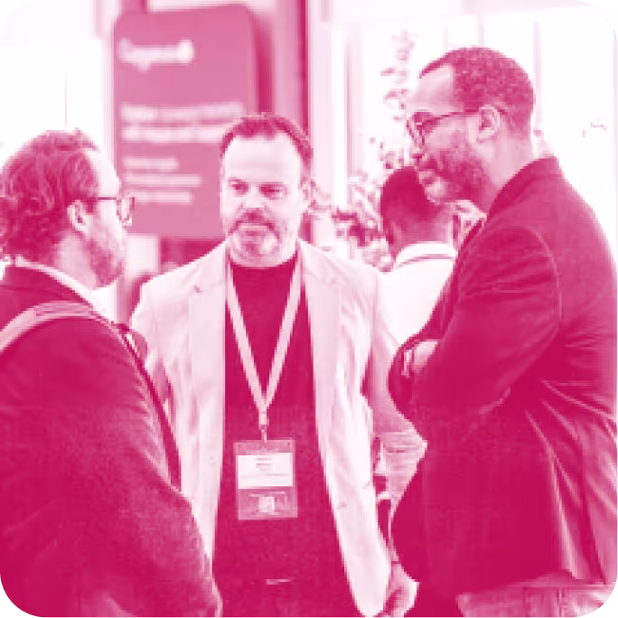 group of people talking at a conference