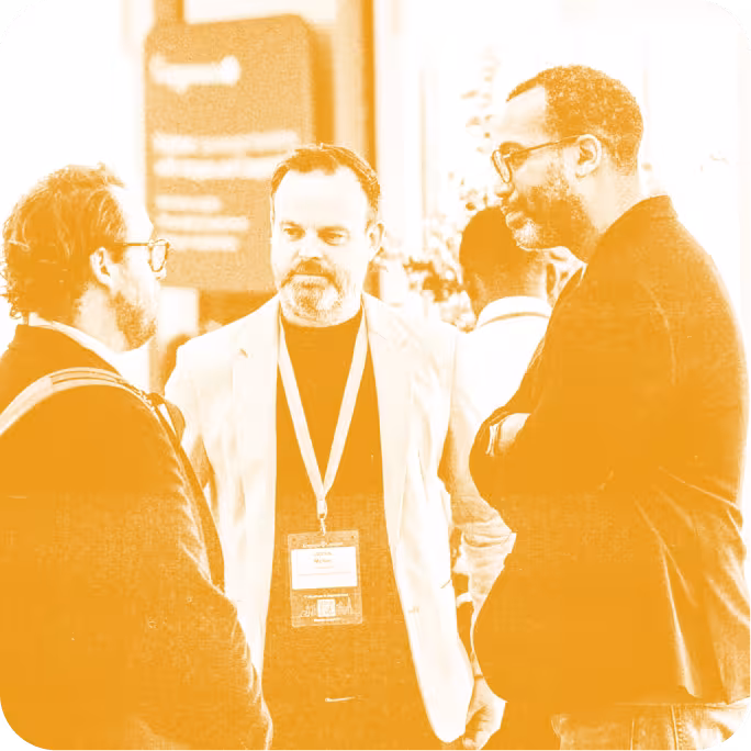 group of people talking at a conference